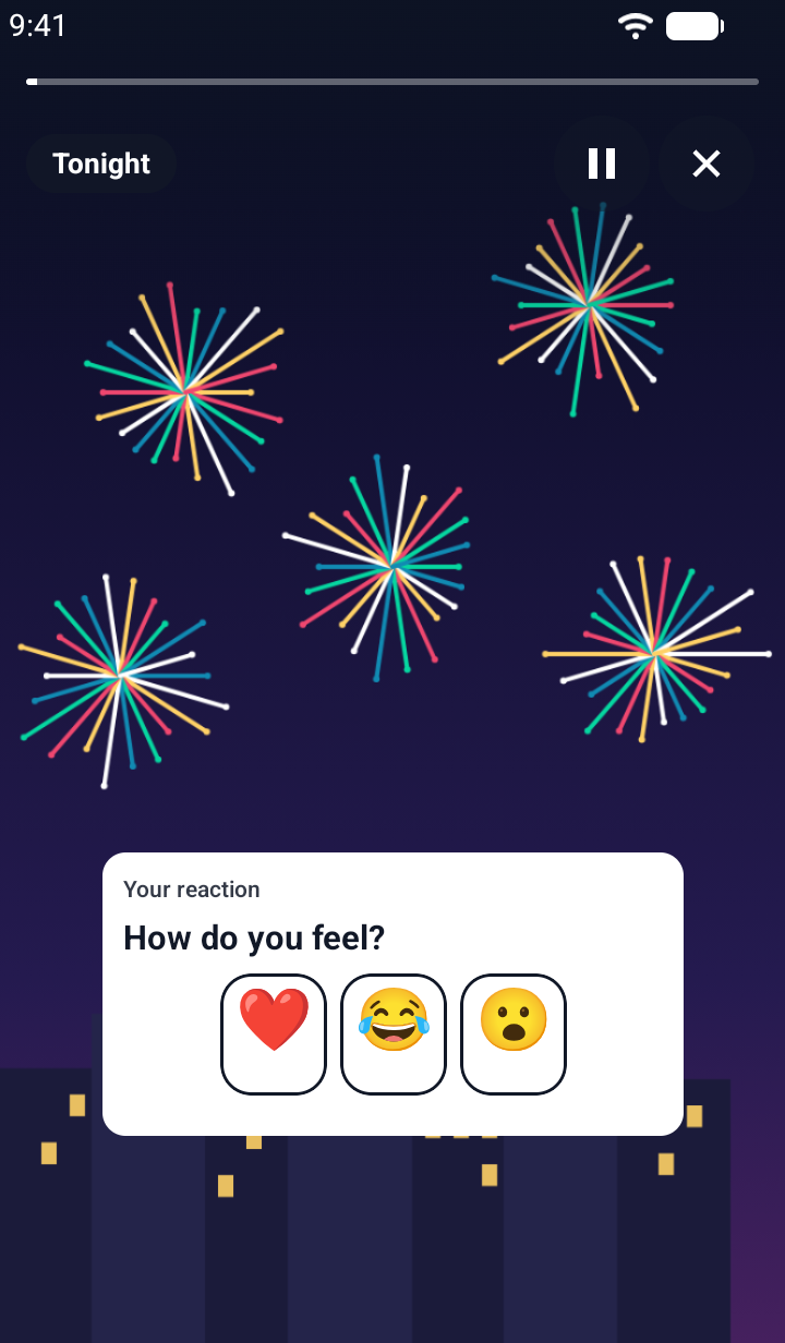 Screenshot of a TaleArt sample reaction on Android over fireworks on a night sky: a white card titled 'Your reaction' with the question 'How do you feel?' and three emoji buttons, a heart, a laughing face and a surprised face, before a tap.