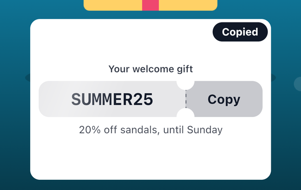 A close-up of the promo code card on iOS just after Copy: the card's top, the ticket with the code SUMMER25 and the Copy stub, and a dark Copied toast over the card's top corner.