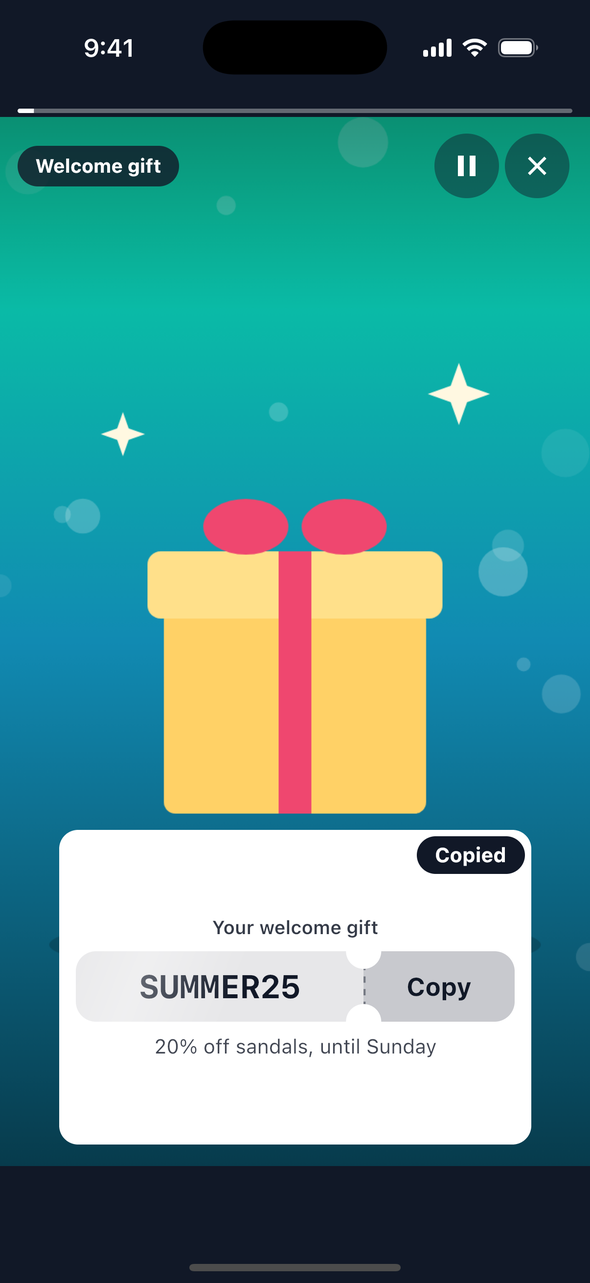 The same promo code card on iOS just after Copy was pressed: a dark 'Copied' toast sits over the card's top corner.