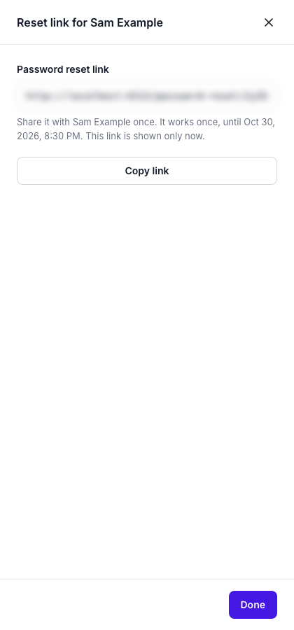 The Reset link for Sam Example dialog. The Password reset link field is blurred, and a note says the link works once until a date and is shown only now. Copy link and Done are below it.